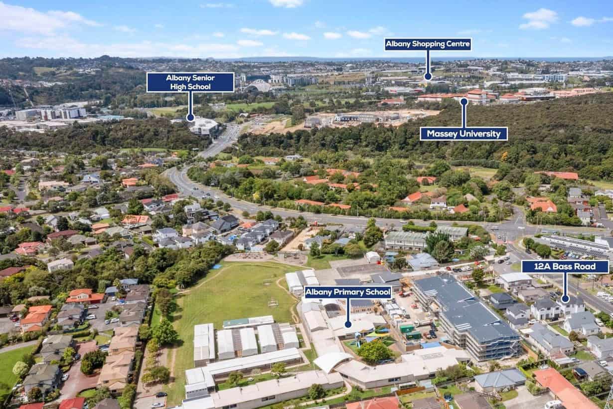 Aerial over Albany marking Massey University, Albany Shopping Centre and nearby schools