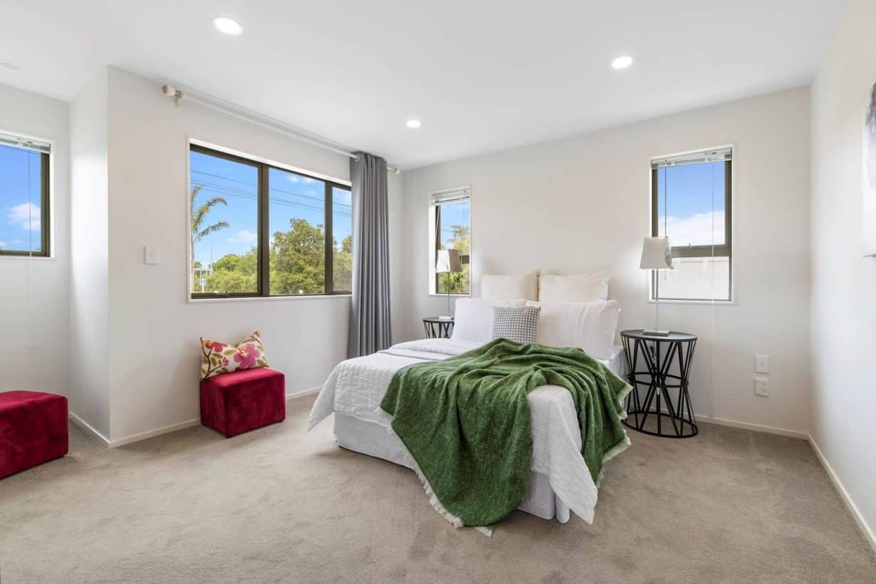 Bedroom with windows on two adjoining walls, Albany Village