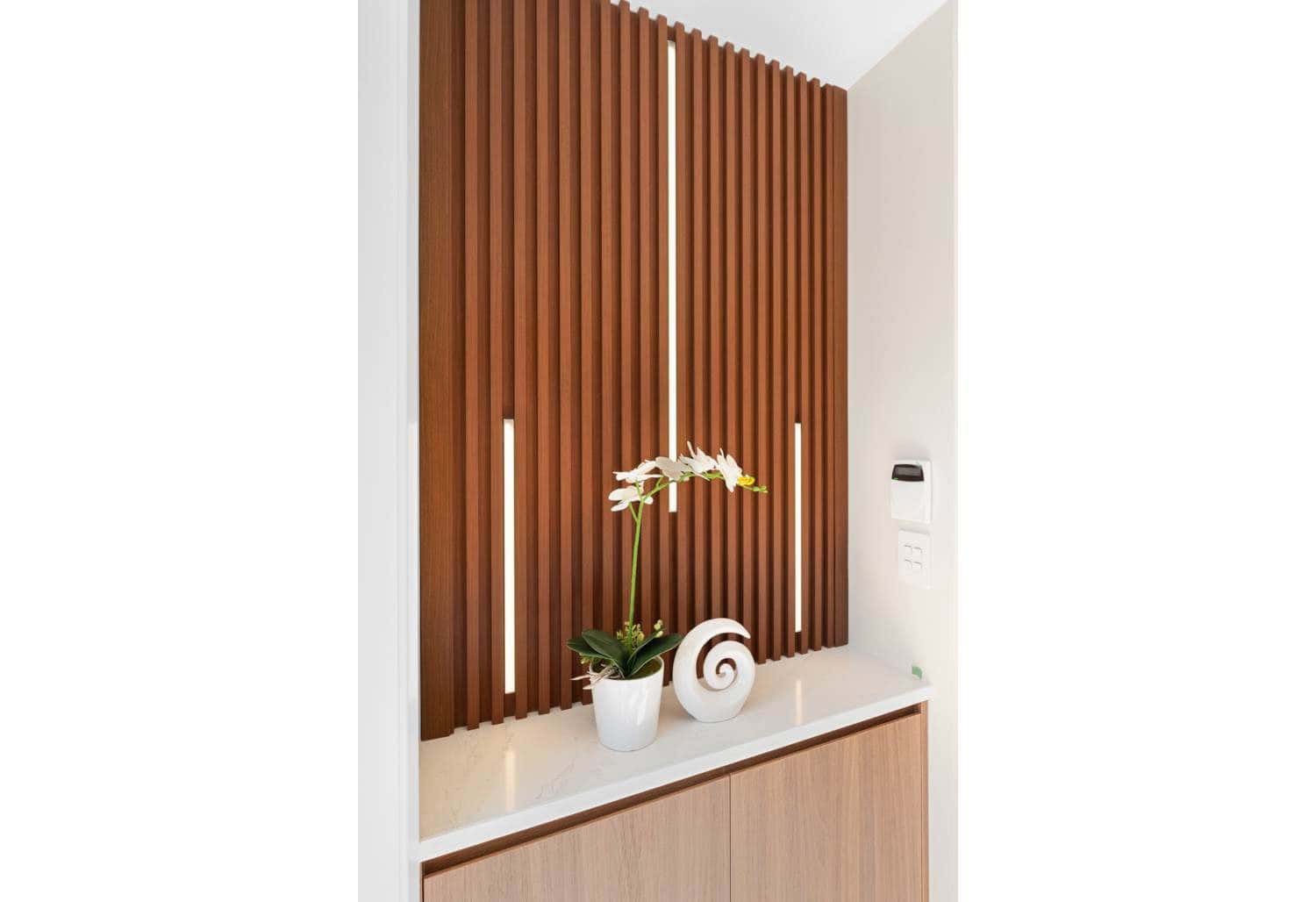 Timber slat screen beside the entry with a display shelf, Browns Bay