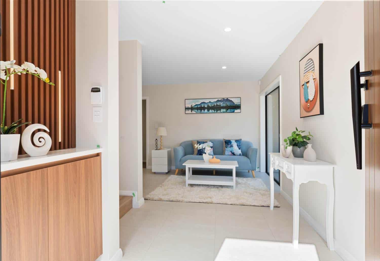 Entry looking past a timber slat screen into the living room, Browns Bay