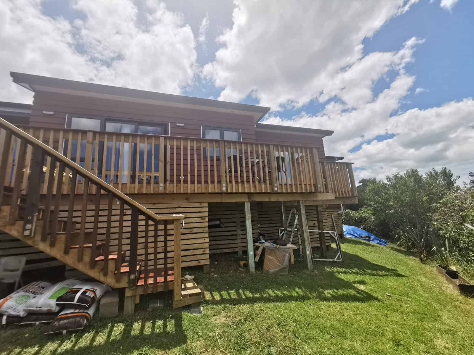 Rear of the house with the existing timber deck and stair before work, Botany Downs