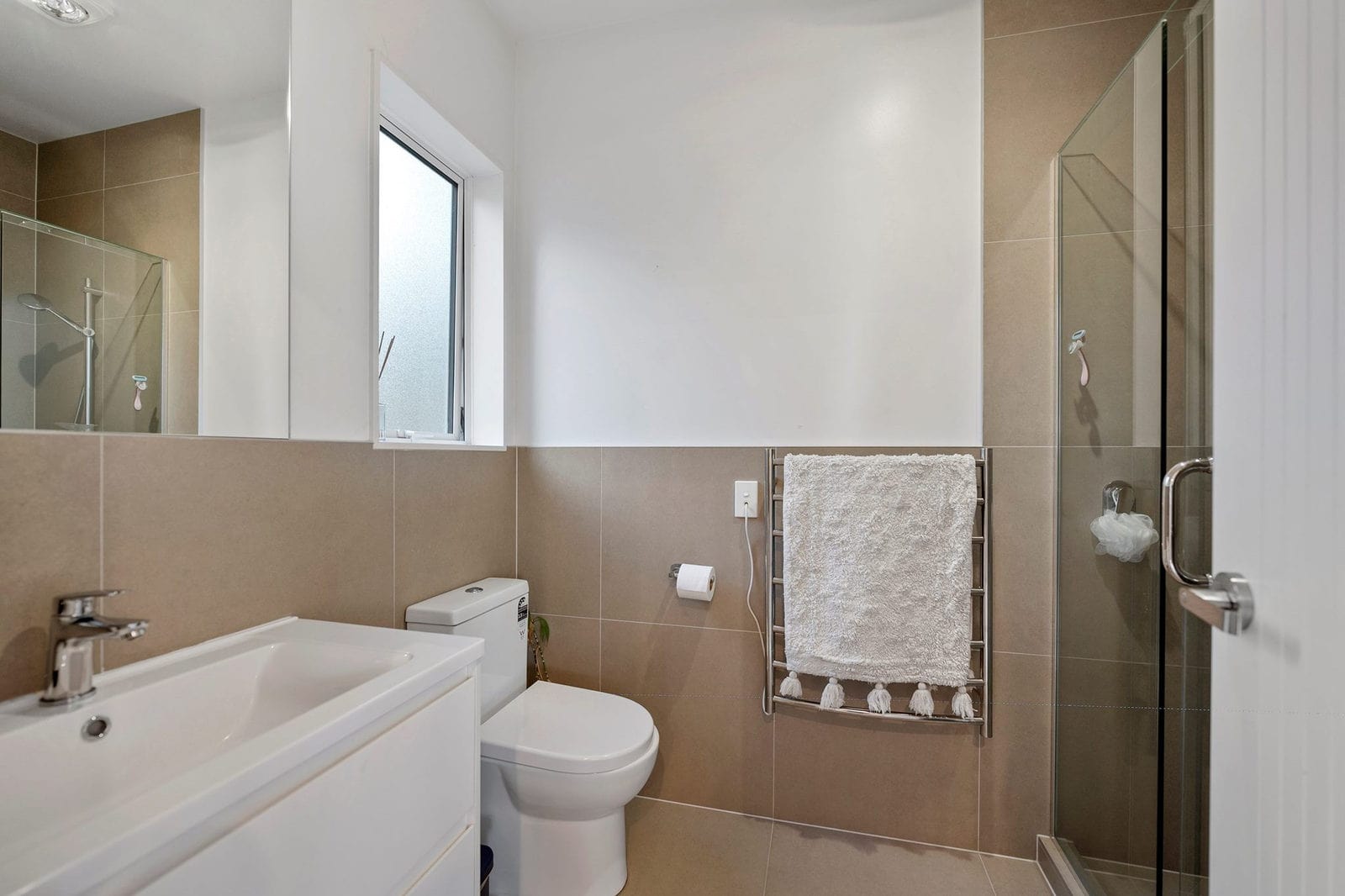 Bathroom with a bath, toilet, glazed shower and half-height tiling, Coatesville