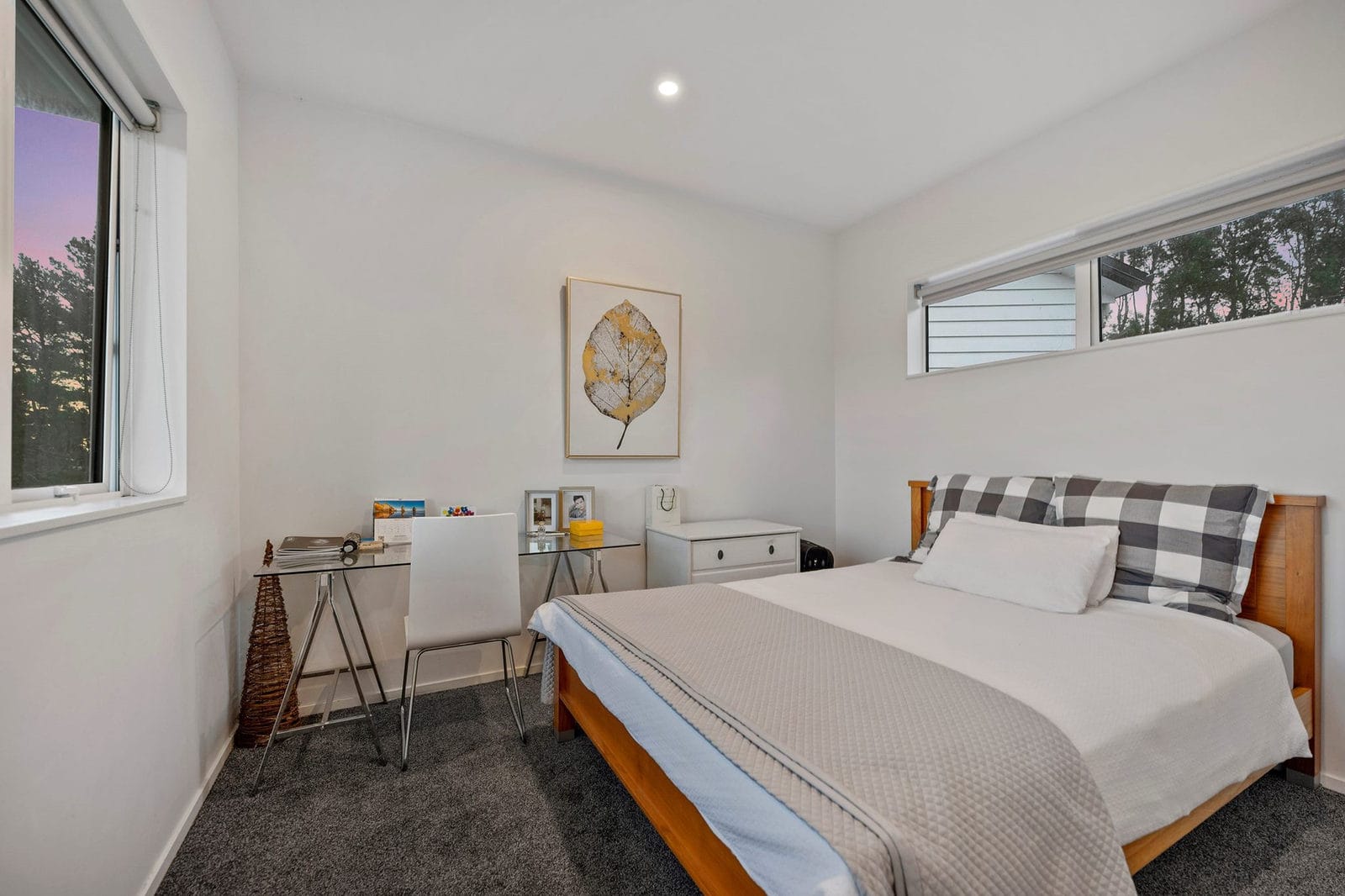 Bedroom with a desk under a high window and a checked throw on the bed, Coatesville