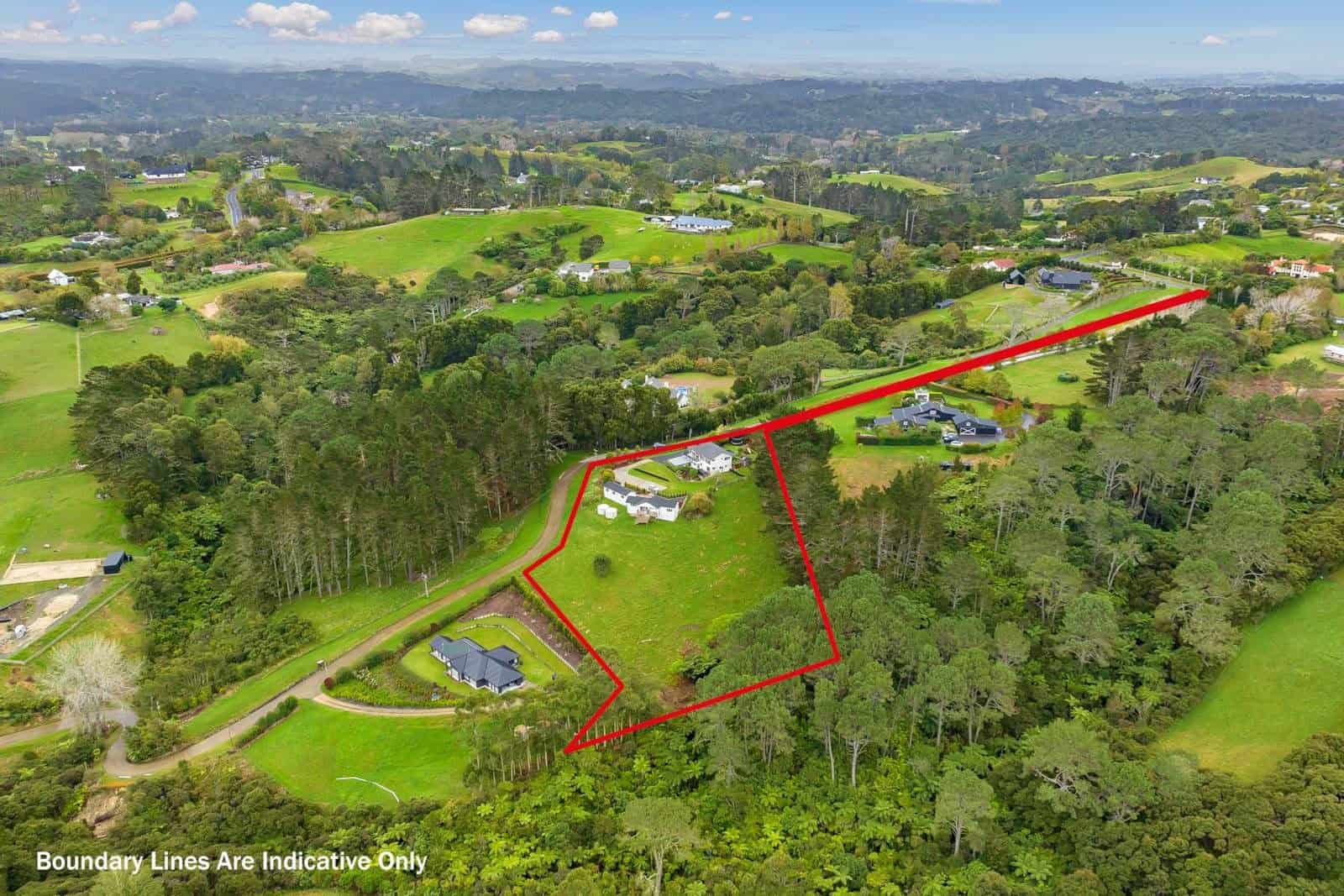 Wide aerial over rolling countryside with the property boundary outlined in red, Coatesville