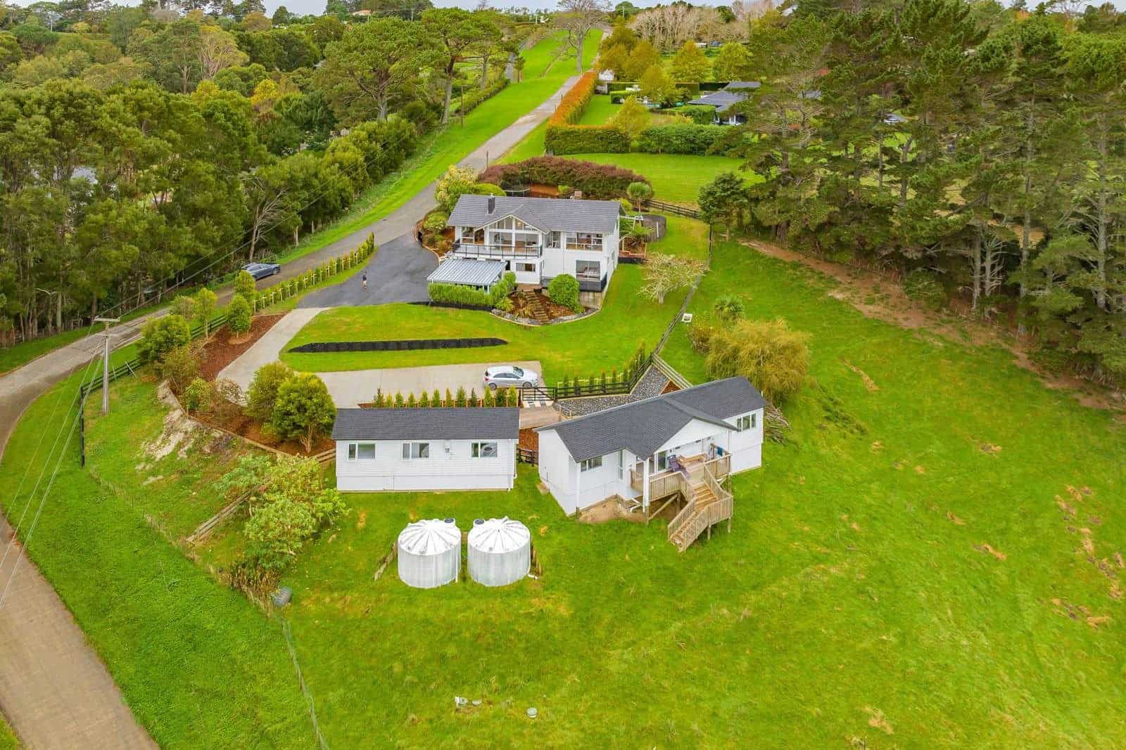 Aerial looking down on the main house, the minor dwelling and the water tanks, Coatesville