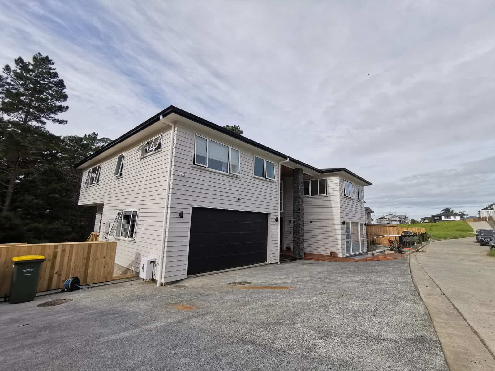 Completed two-storey weatherboard house with an integrated garage, Albany