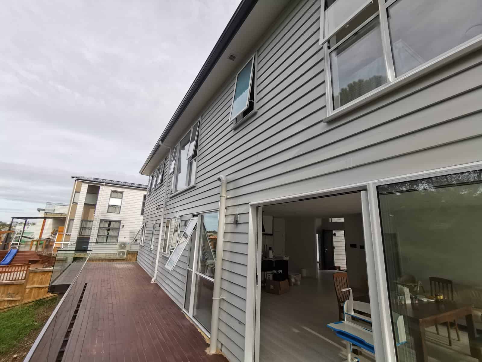 Side elevation with sliding doors opening onto the timber deck, Albany