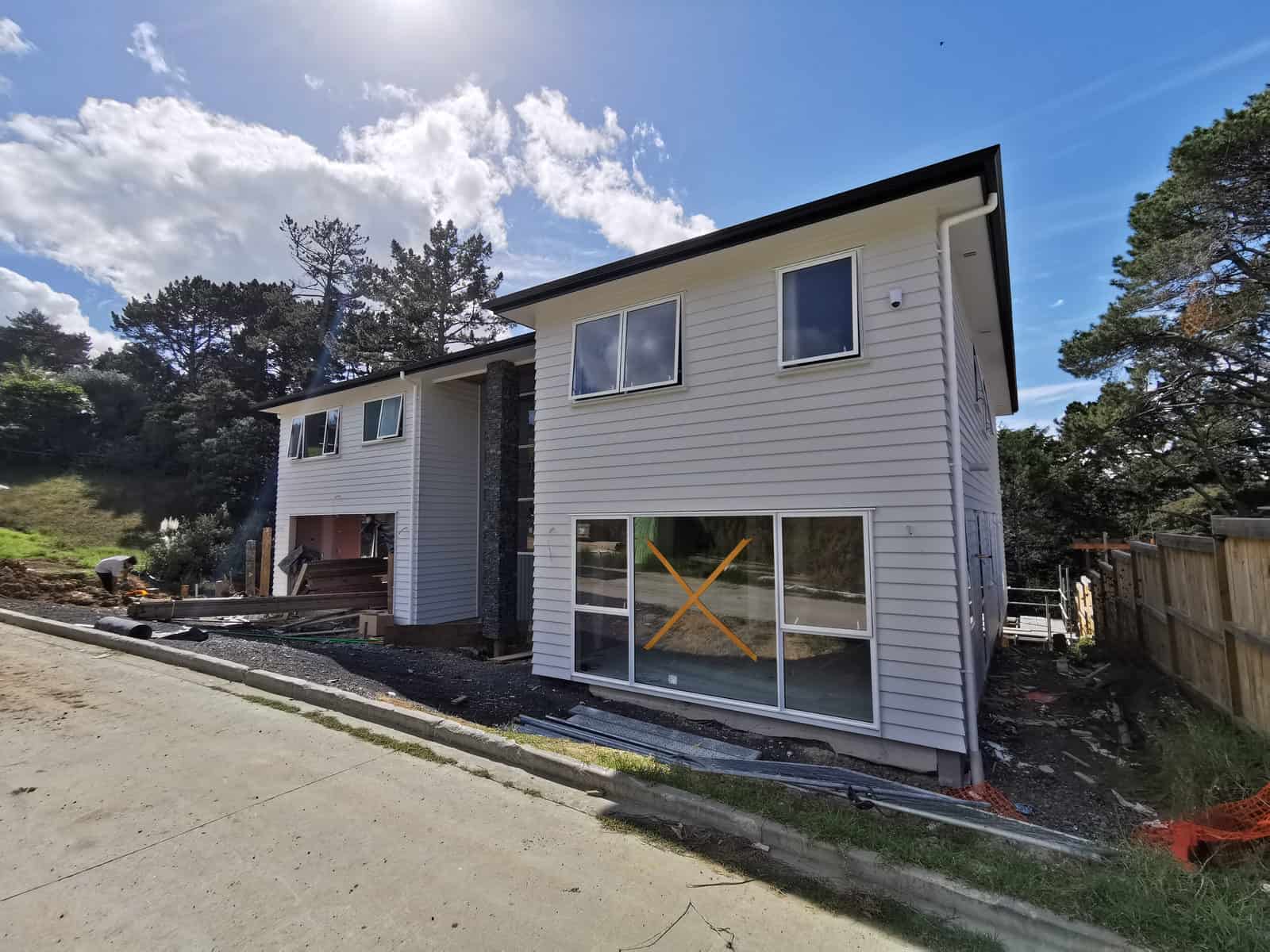 Rear of the house late in the build with the windows still taped, Albany