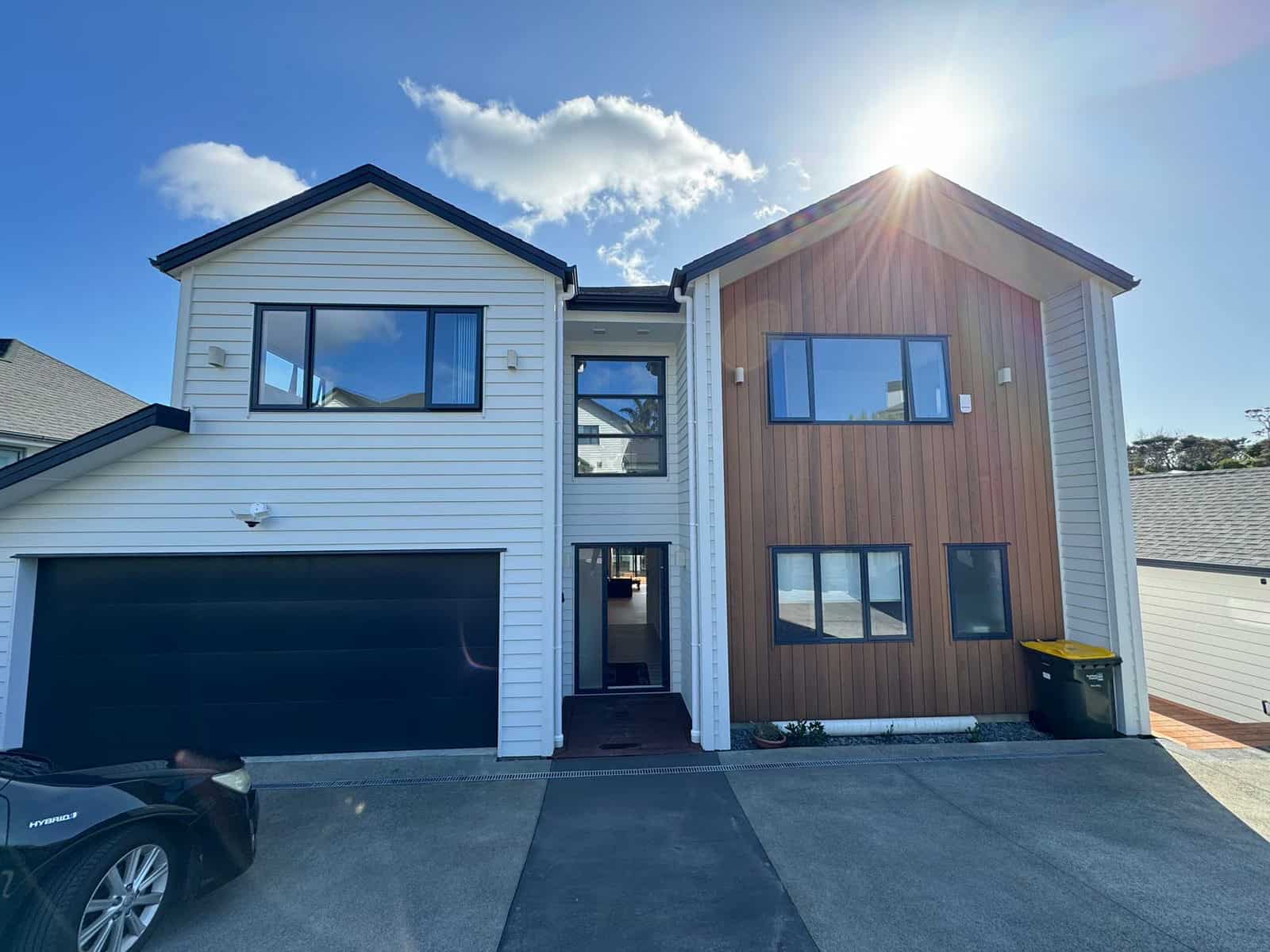 Front of the house with the double garage and timber-clad entry bay, Greenhithe