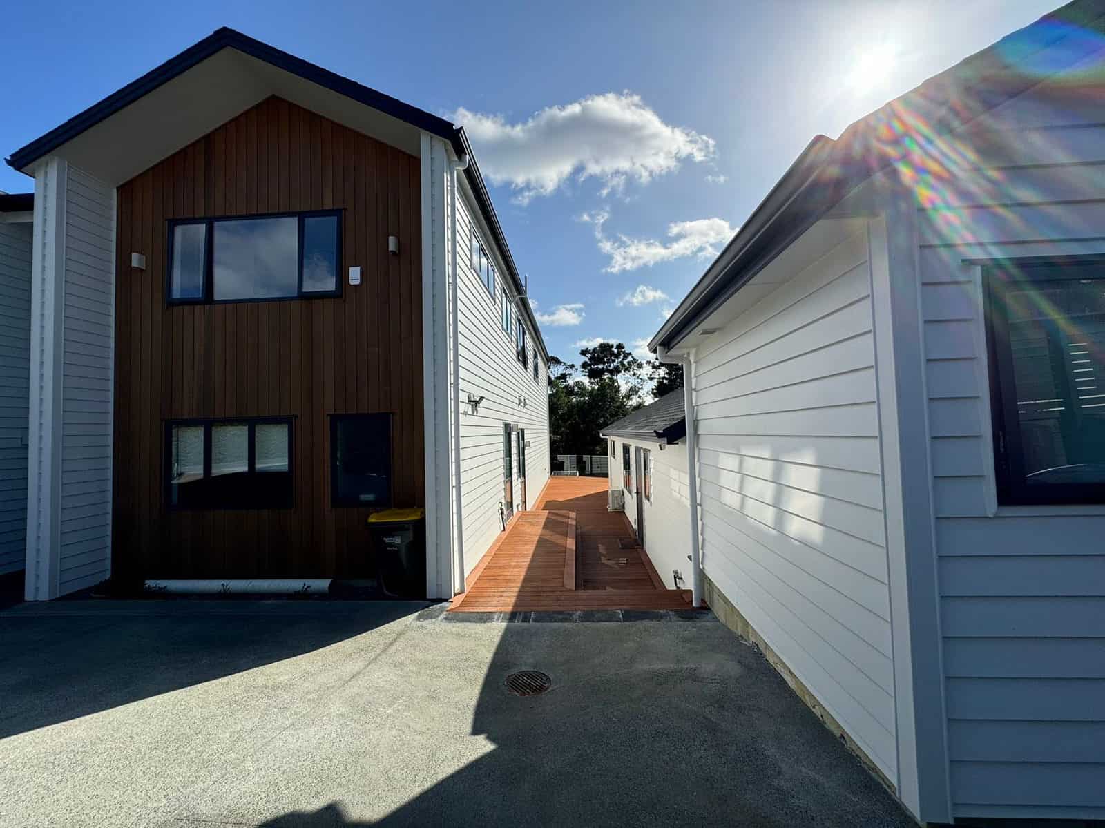 Looking down the drive between the two buildings to the deck beyond, Greenhithe
