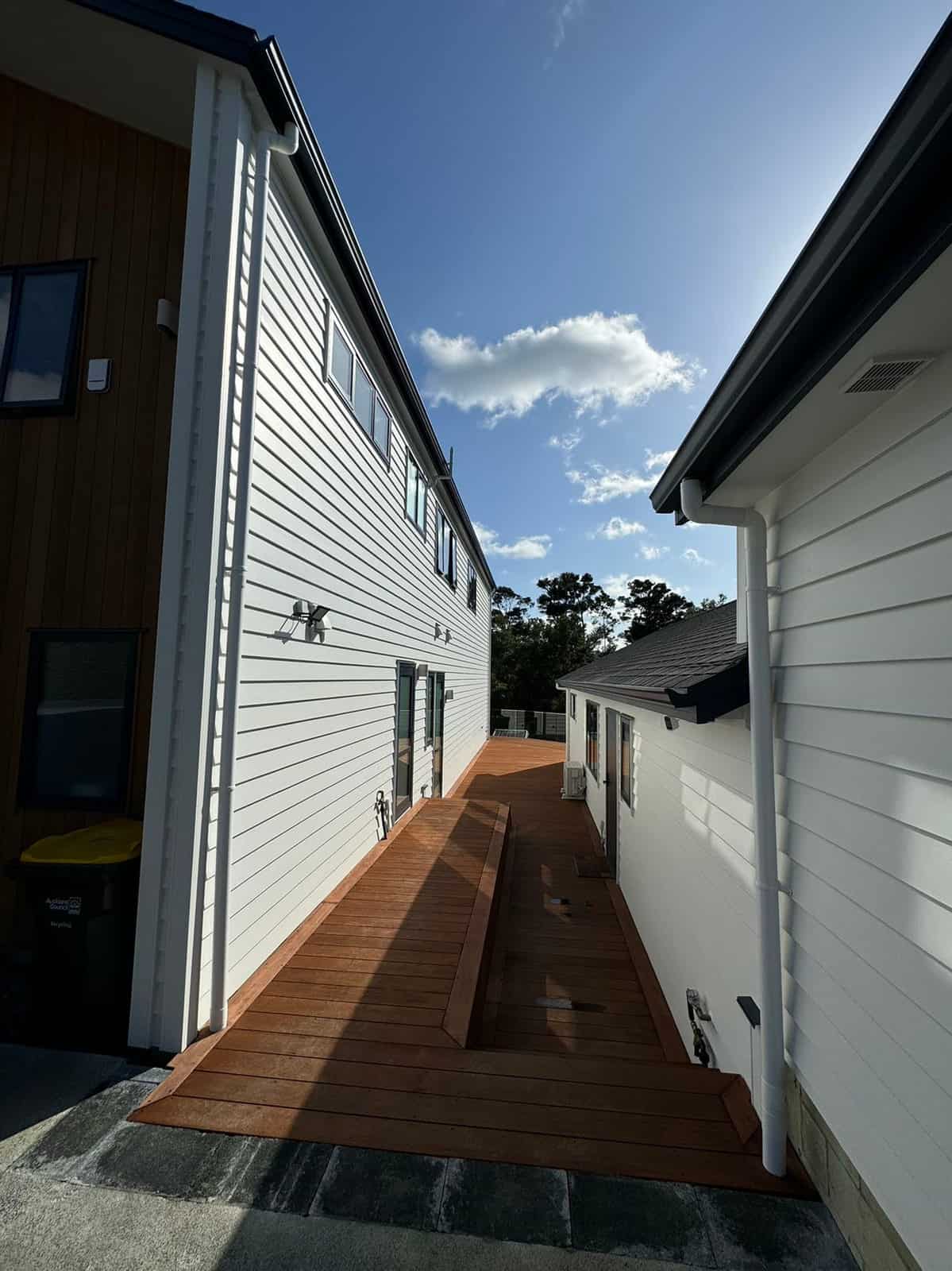 Hardwood deck path running between the two buildings, Greenhithe