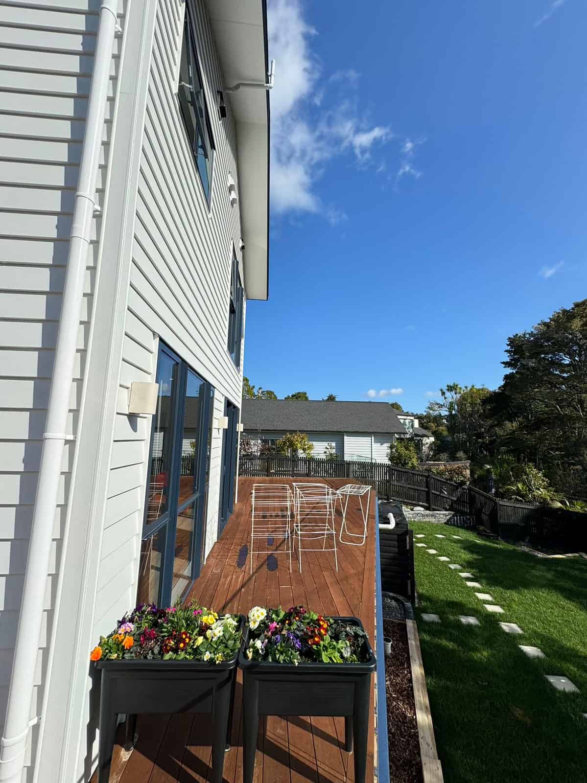 Planter boxes on the deck looking down the lawn to the neighbouring houses, Greenhithe