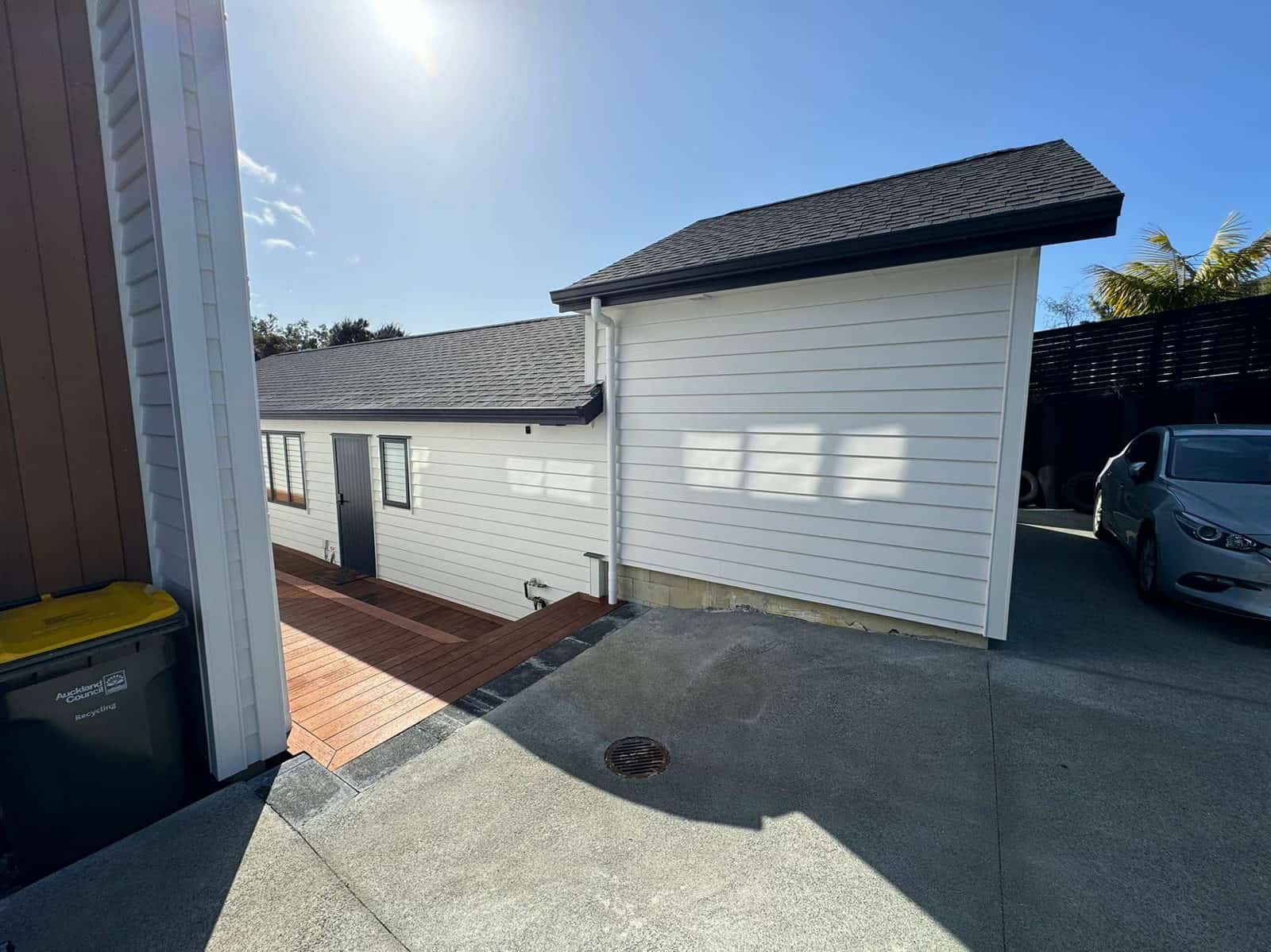 Second dwelling and its garage door across the paved drive, Greenhithe