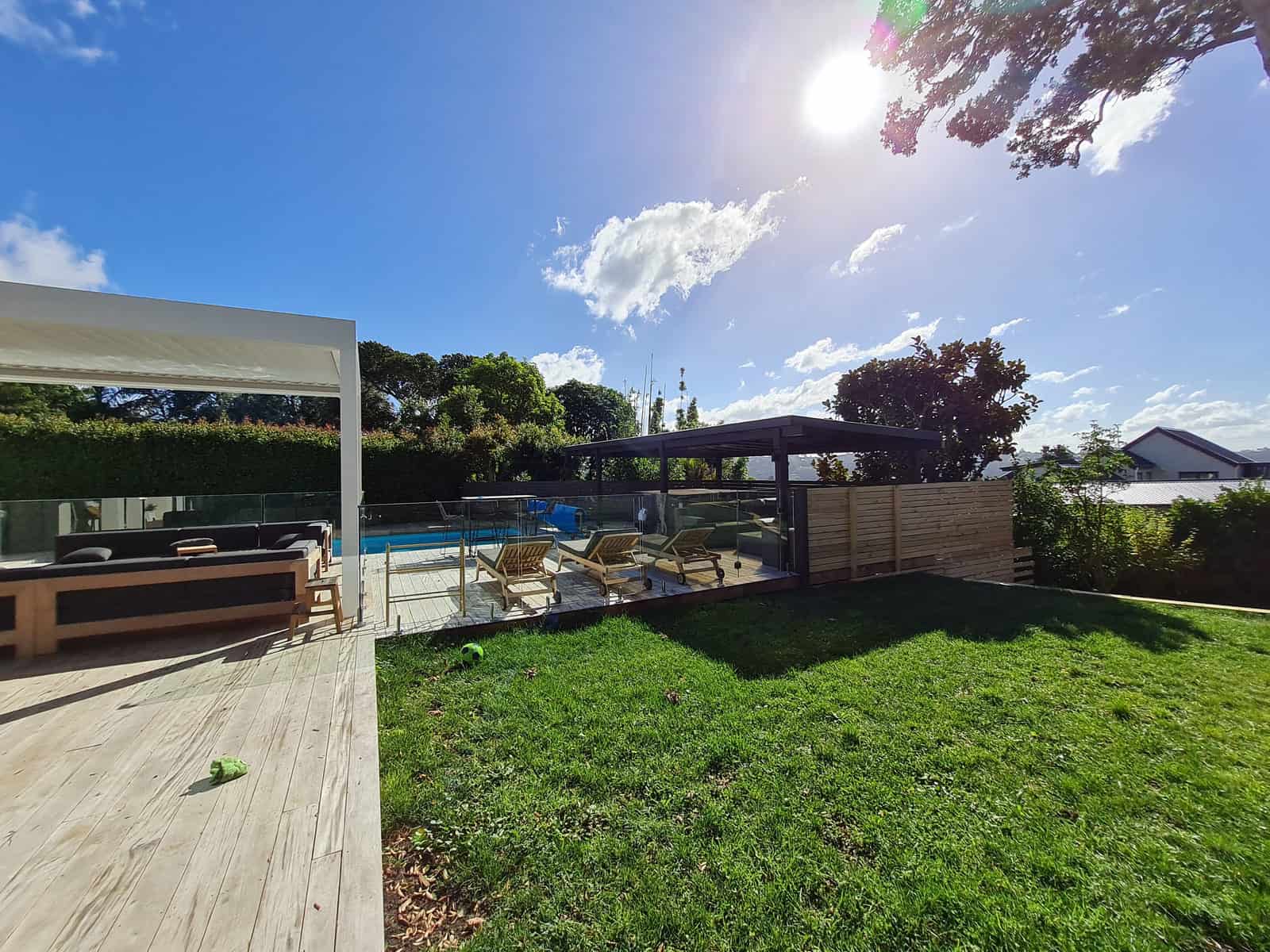Pool, deck and louvre shelter seen from the lawn, Greenhithe