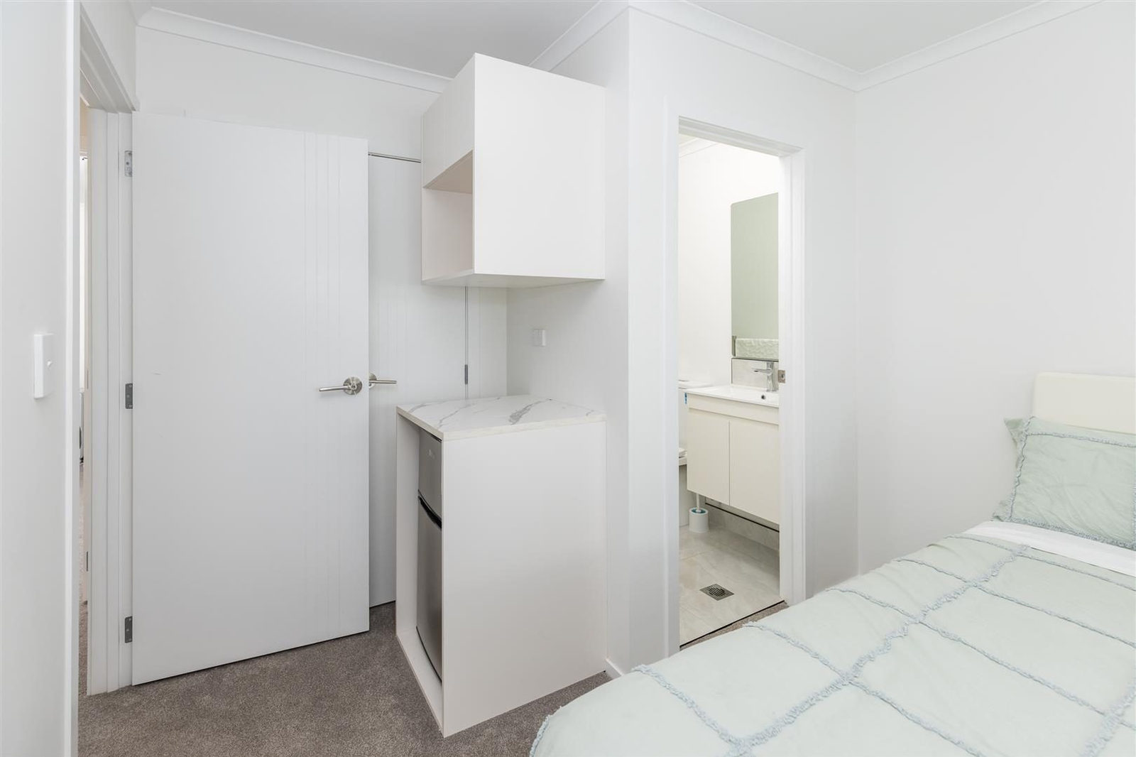 Bedroom with a kitchenette and an ensuite through the doorway, Hamilton