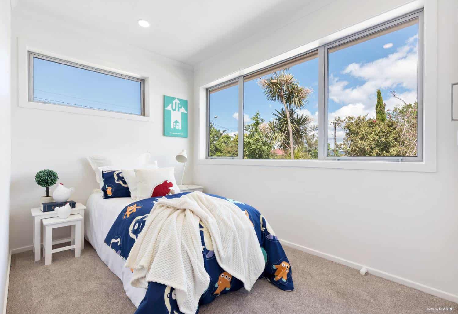 Bedroom with two windows and a navy throw across the bed, Te Atatu South