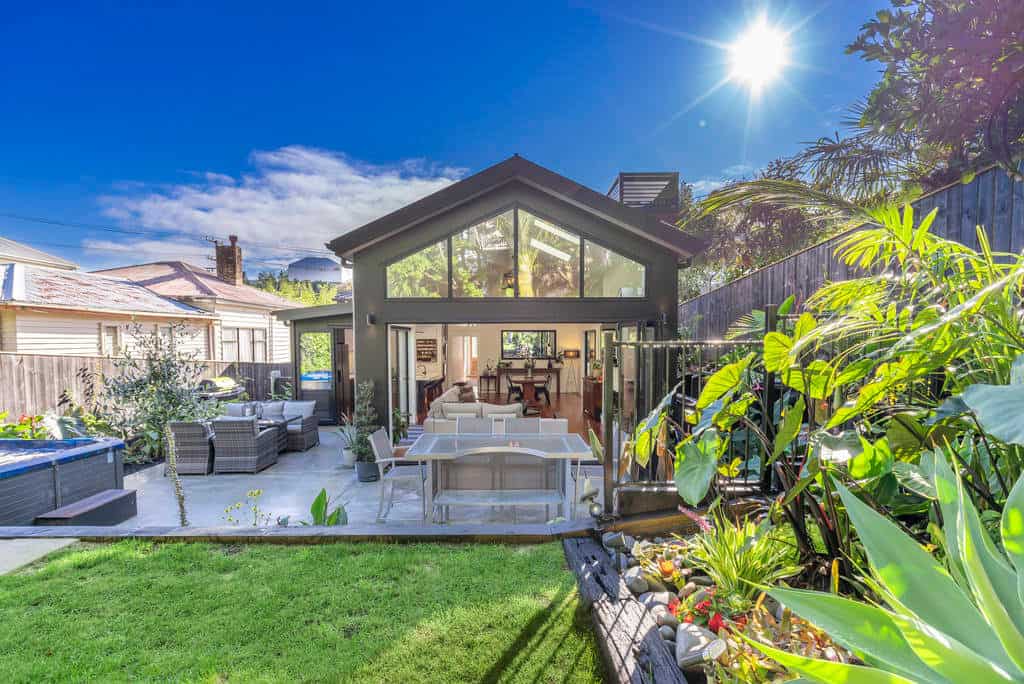 Rear extension with a full-height glazed gable opening onto a deck, Kingsland