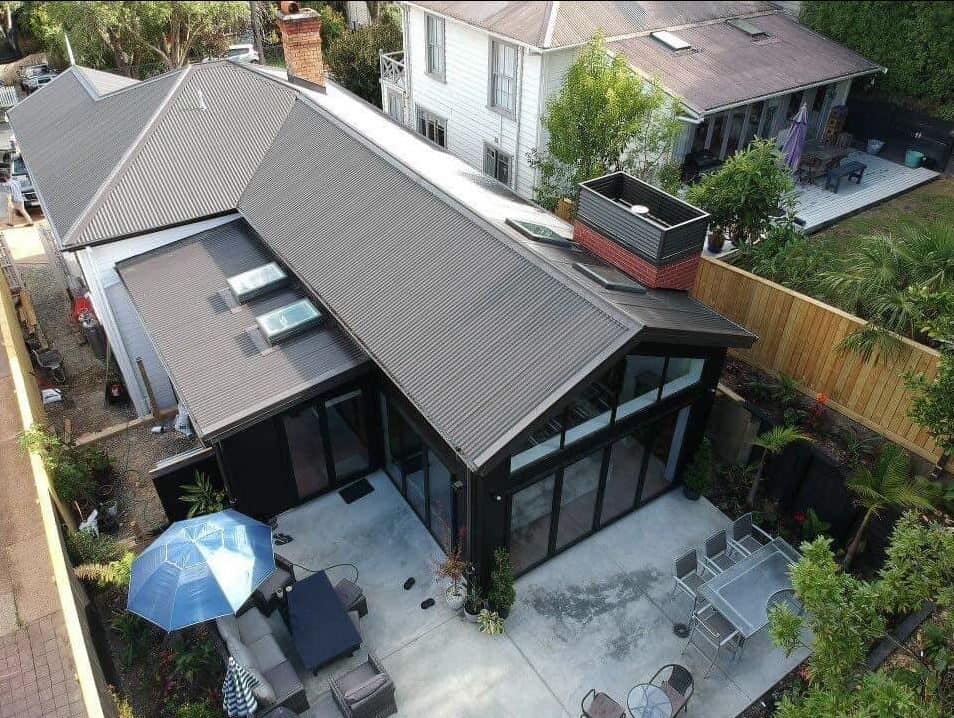Aerial looking down on the dark-roofed extension and courtyard, Kingsland