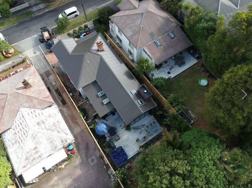 Aerial over the site showing the villa, the new extension and neighbouring roofs, Kingsland