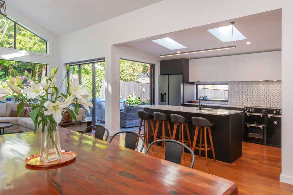 Dining table looking through to the kitchen island and bar stools, Kingsland