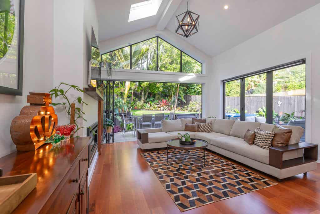 Living room with a raked ceiling, glazed gable and a corner sofa, Kingsland