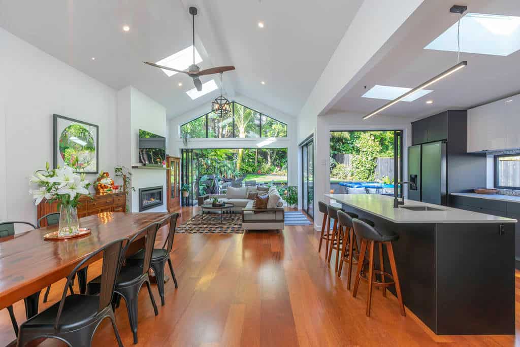 Dining and living under the raked ceiling looking out to the garden, Kingsland