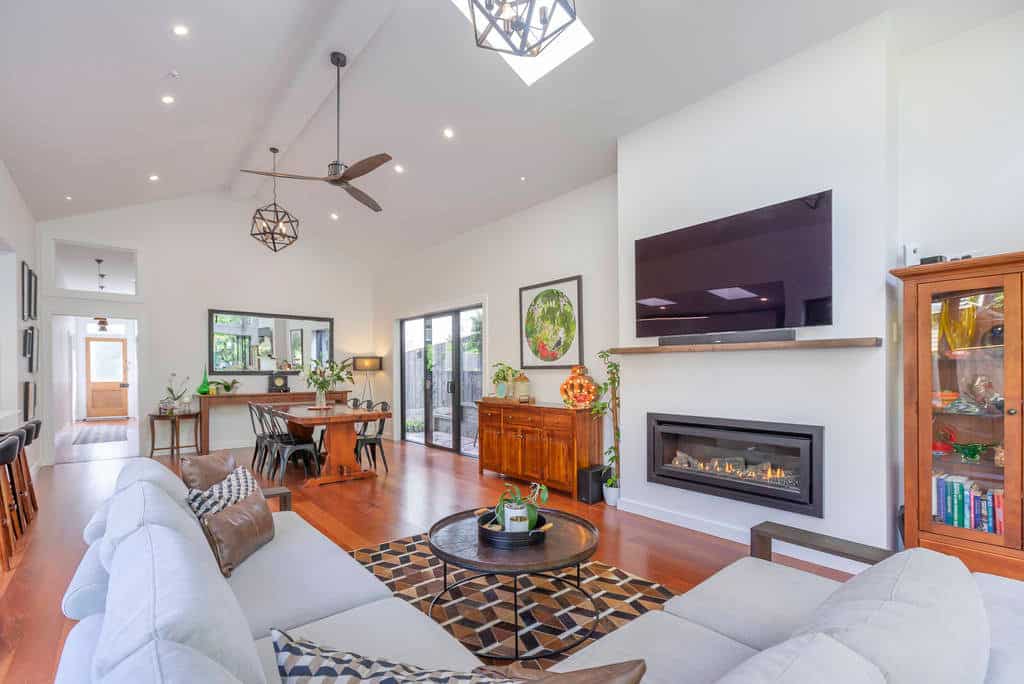Living room with a gas fire looking back through to the dining area, Kingsland
