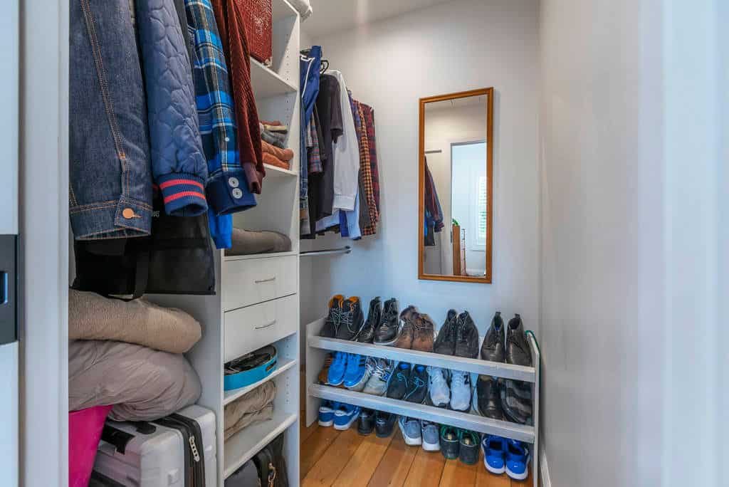 Walk-in wardrobe with hanging clothes, shelving and a shoe rack, Kingsland