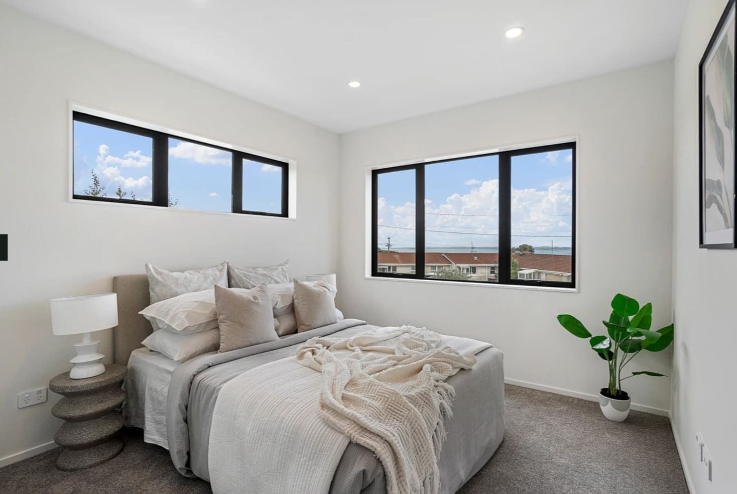 Bedroom with windows on two walls and a clerestory above, Lynfield