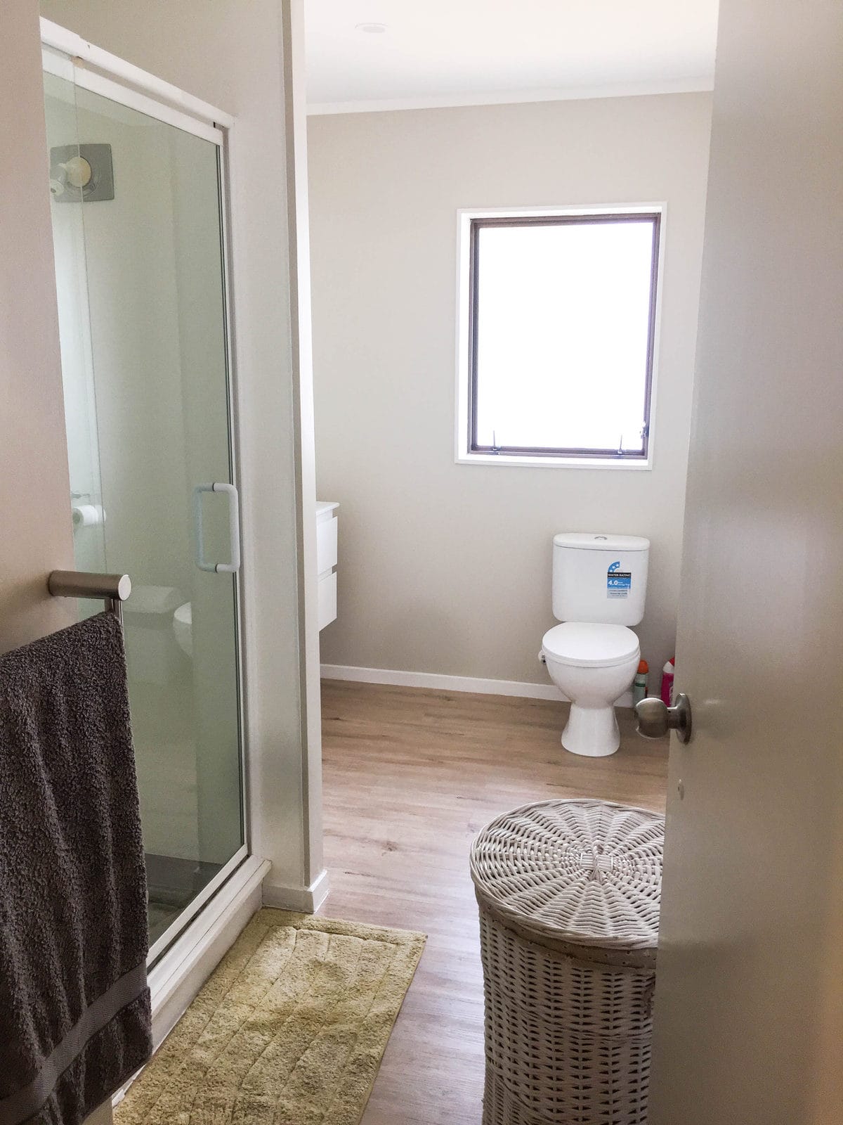 Existing bathroom with a glazed shower, toilet and vanity, Mairangi Bay