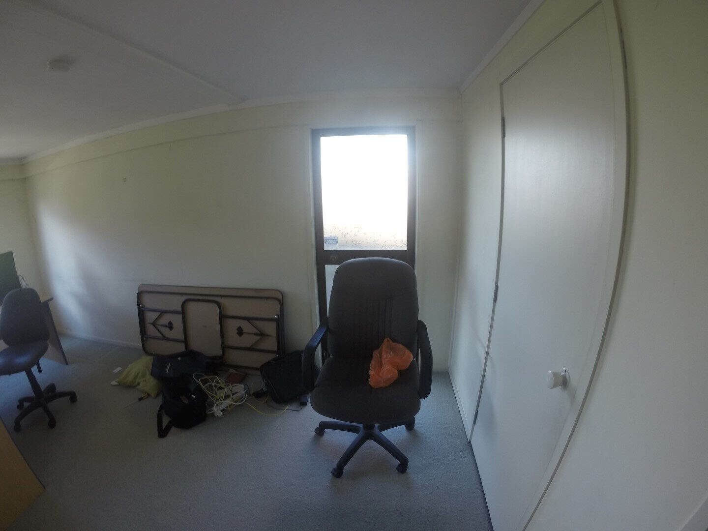 Existing room used as a study with a desk and office chairs, Mairangi Bay