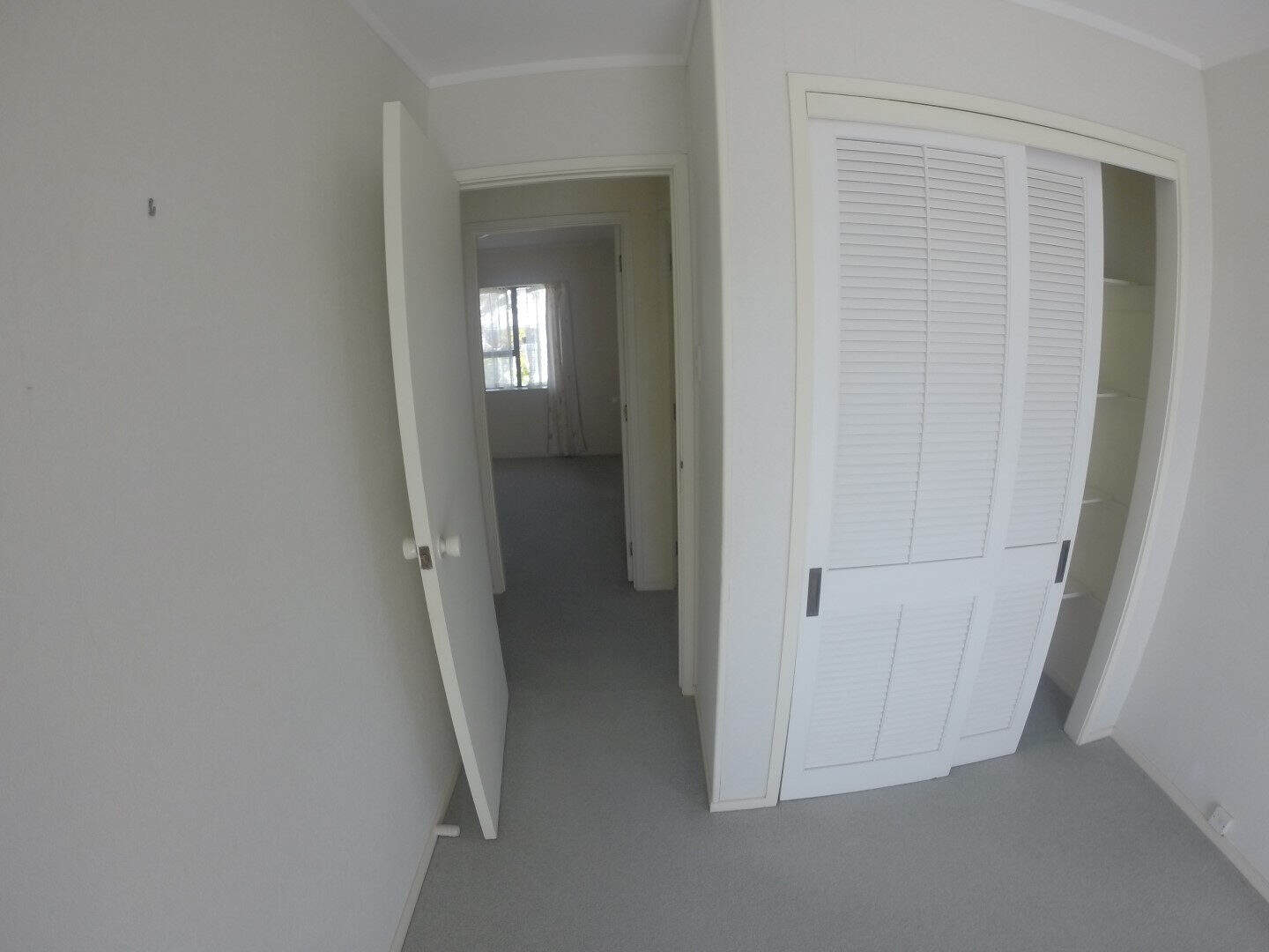 Existing hallway with louvre wardrobe doors, Mairangi Bay