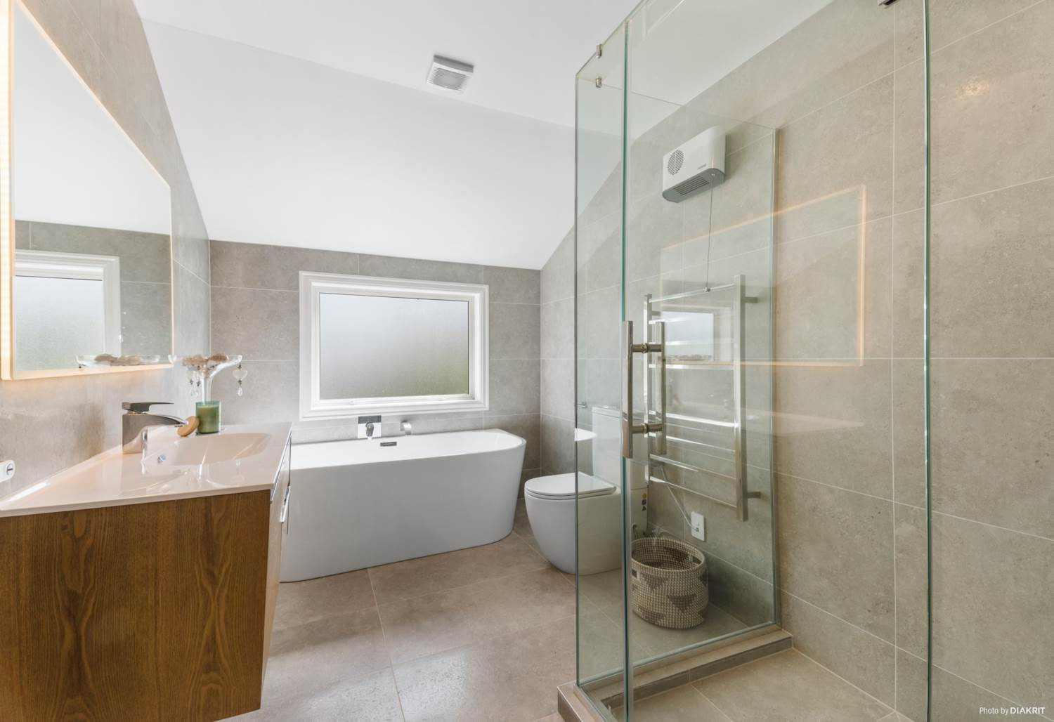 Bathroom with a freestanding bath, timber vanity and a glazed shower, Mairangi Bay