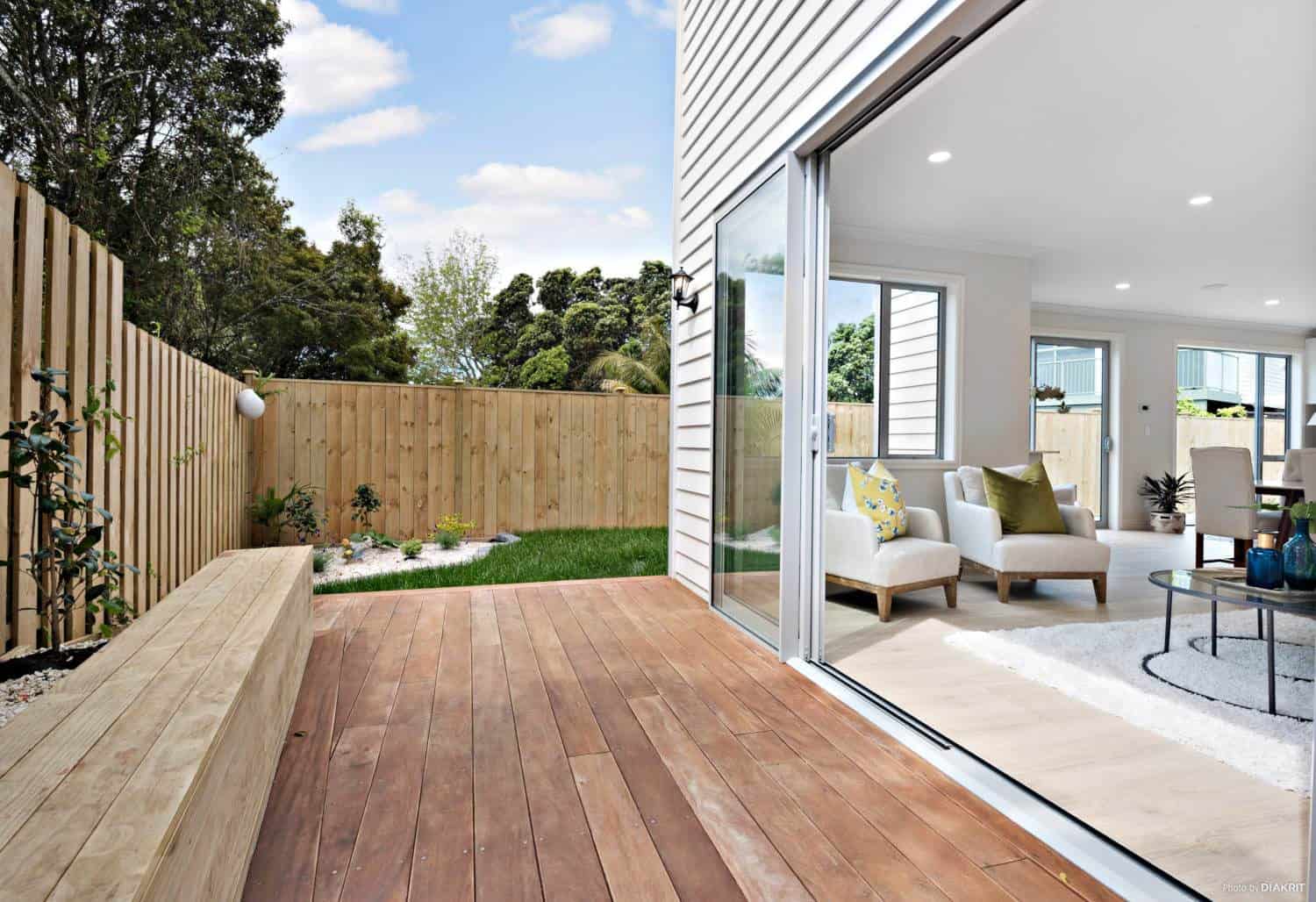 Hardwood deck with built-in seating opening off the living room, Mairangi Bay