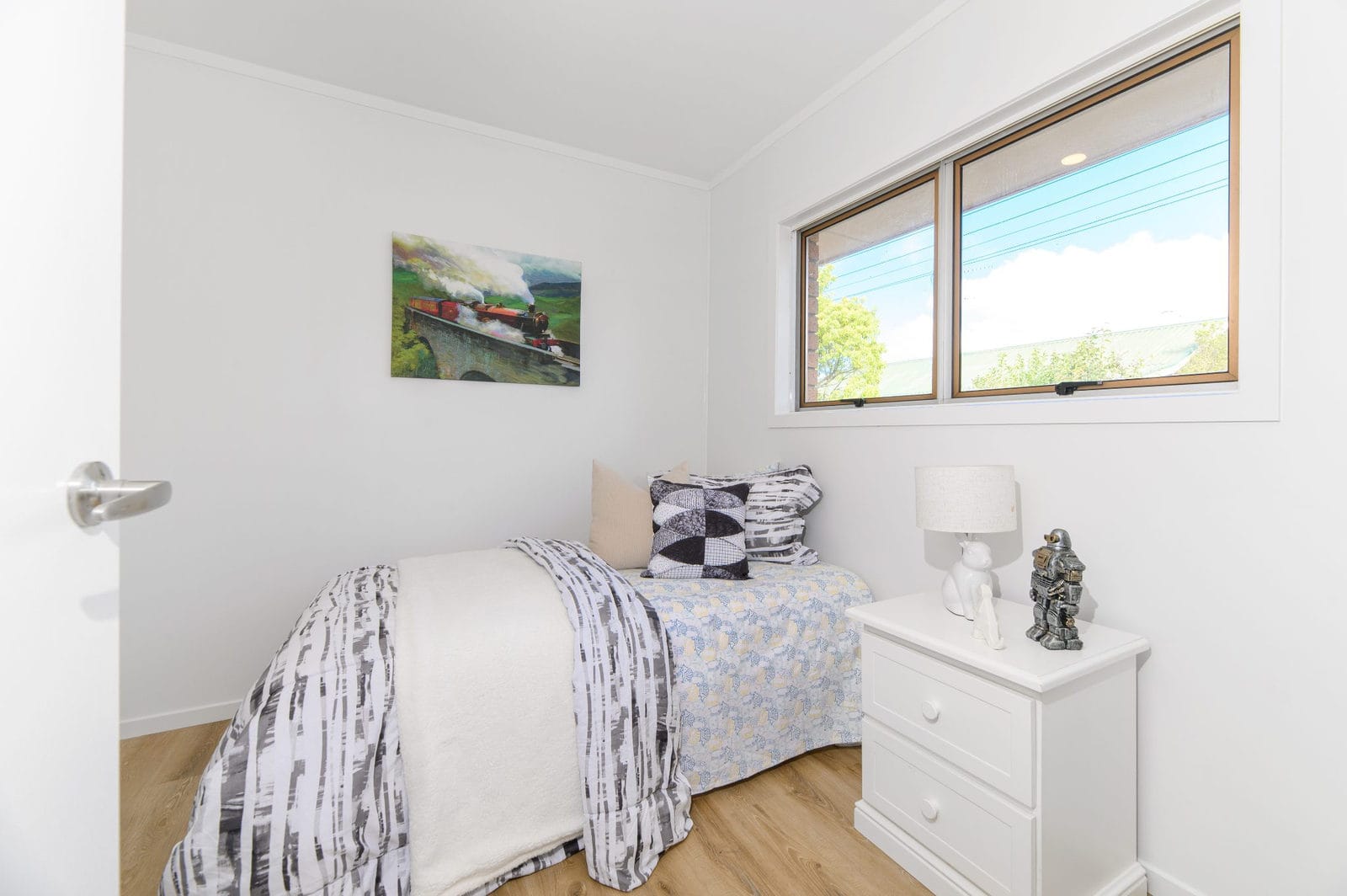 Bedroom with a window and a white bedside chest, Milford