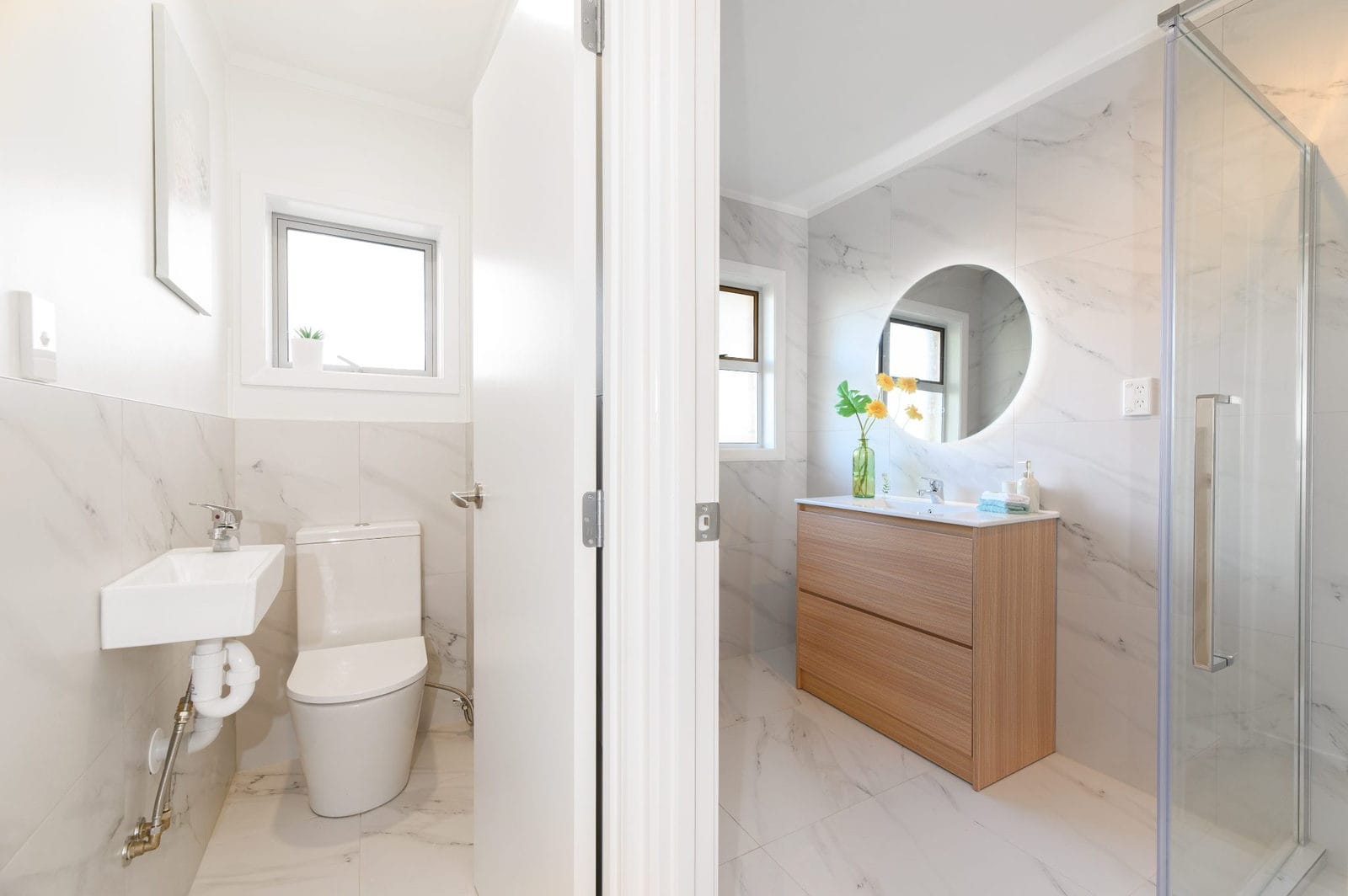Separate toilet beside the bathroom with its timber vanity and shower, Milford