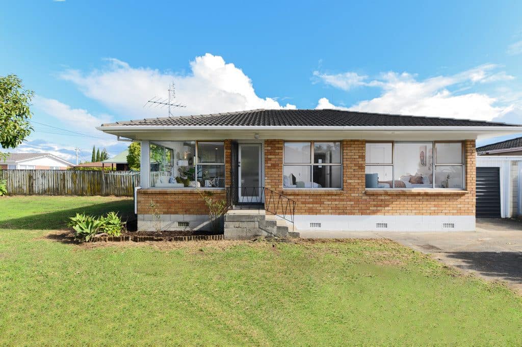Brick and weatherboard unit from the lawn before renovation, Milford