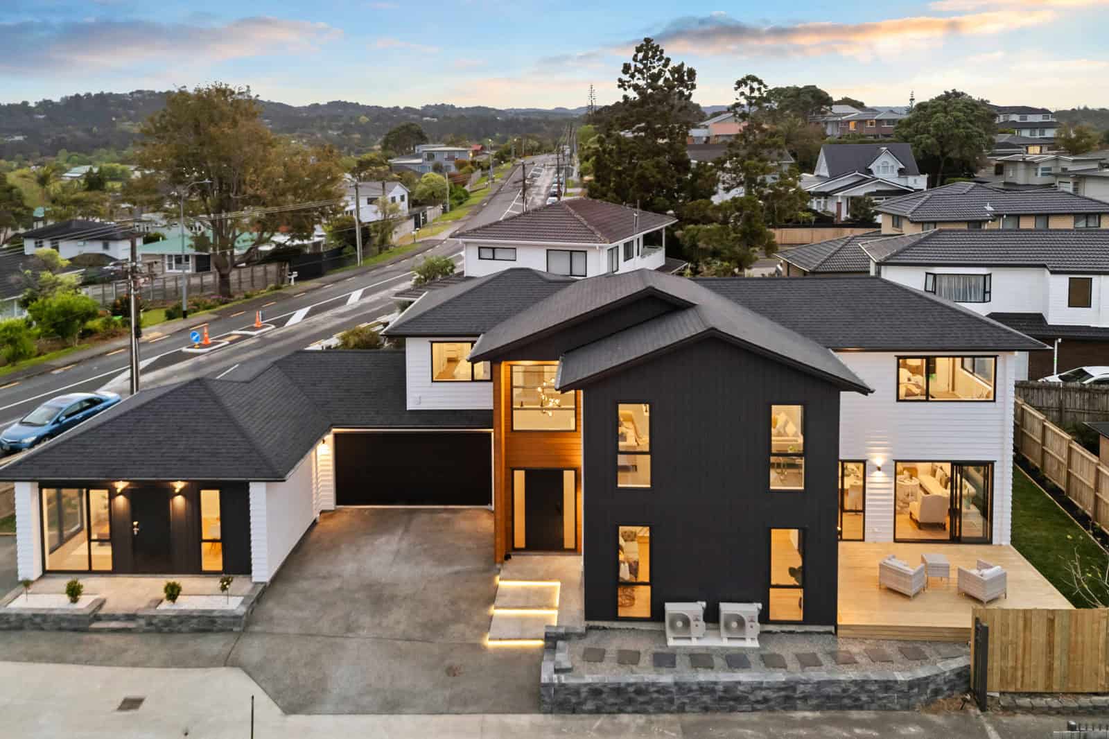 Aerial of two dwellings sharing one site at dusk, New Lynn