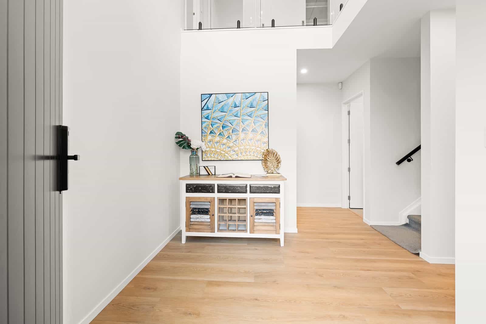Entry with the front door open and the stair beyond, New Lynn