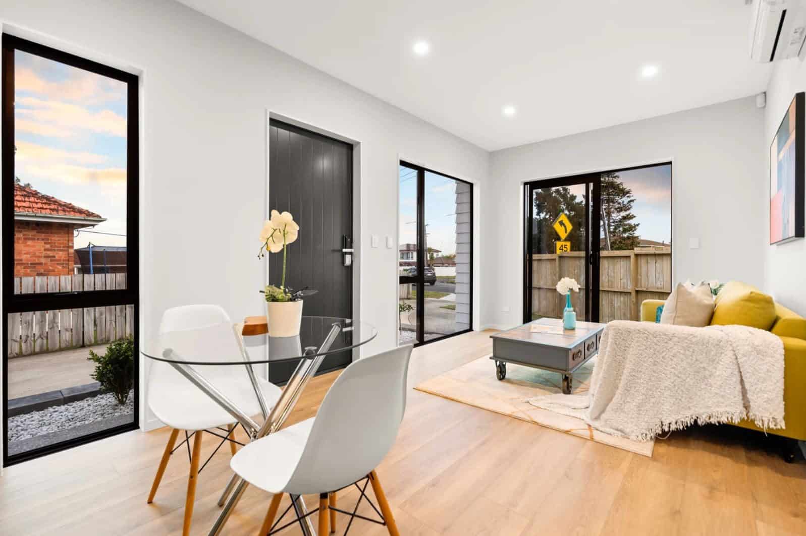 Dining table beside the front door with the living area beyond, New Lynn