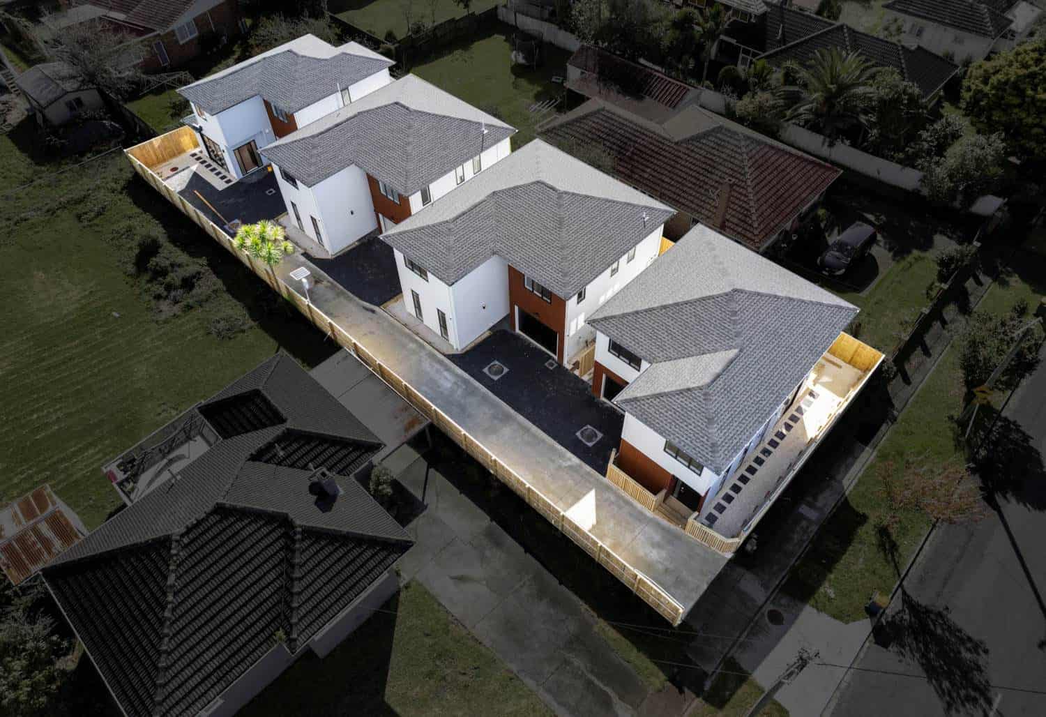 Aerial looking down on four new houses on one subdivided site, New Lynn