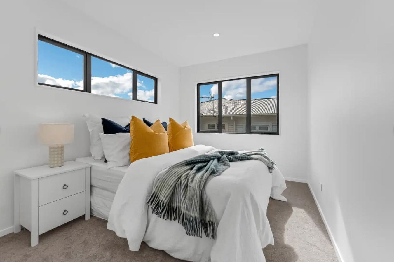 Bedroom with a clerestory window above and a corner window alongside, New Windsor