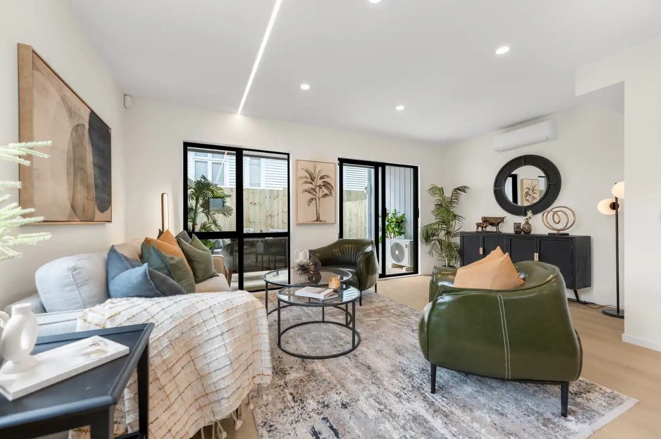 Living area with a leather armchair and a laundry visible off the hallway, New Windsor