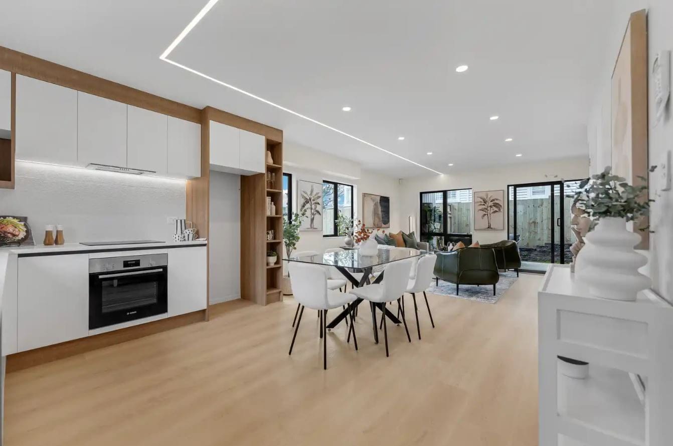 Kitchen with a wall oven and dining table in the open-plan living space, New Windsor