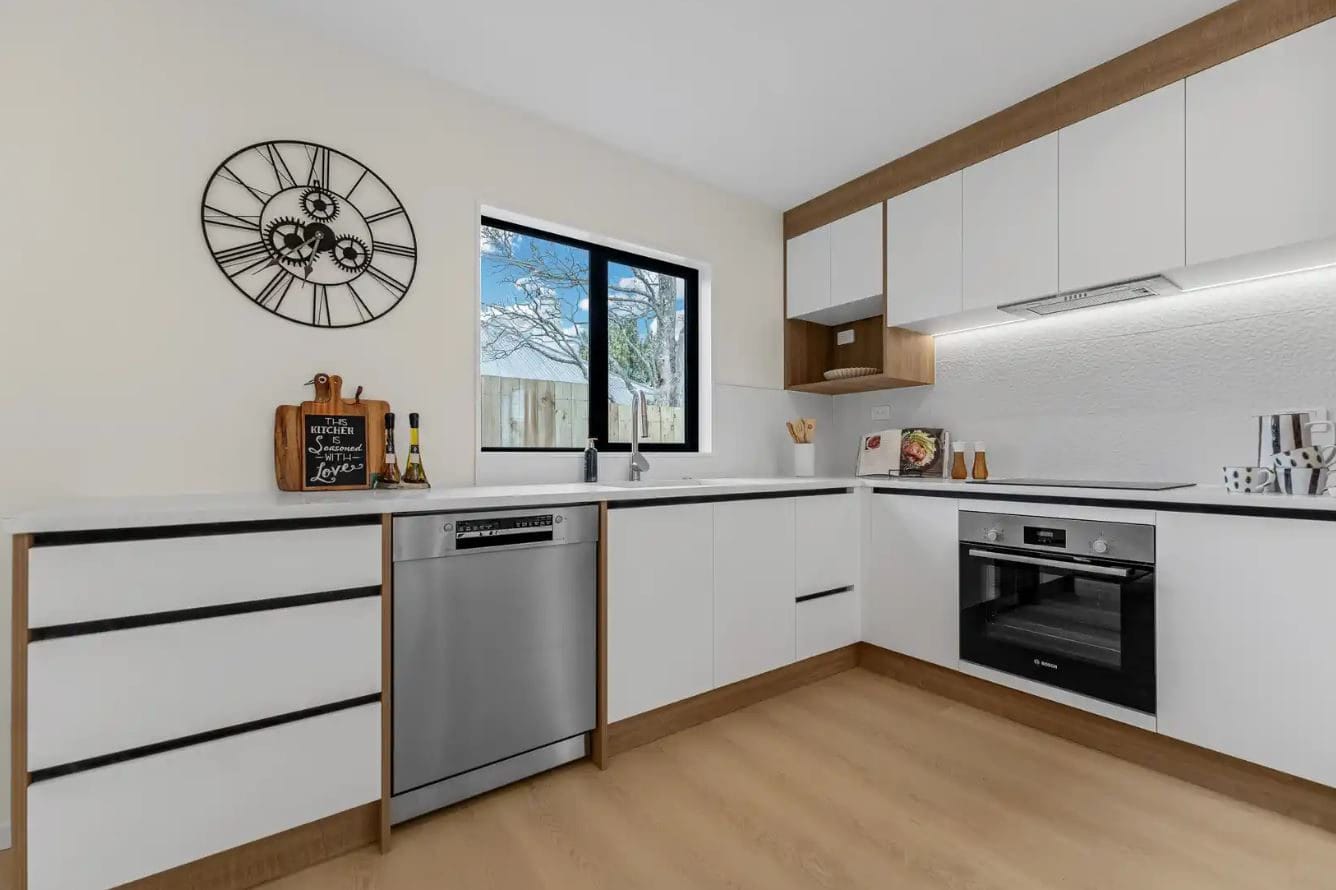 Kitchen with white cabinetry, a dishwasher and a wall oven, New Windsor