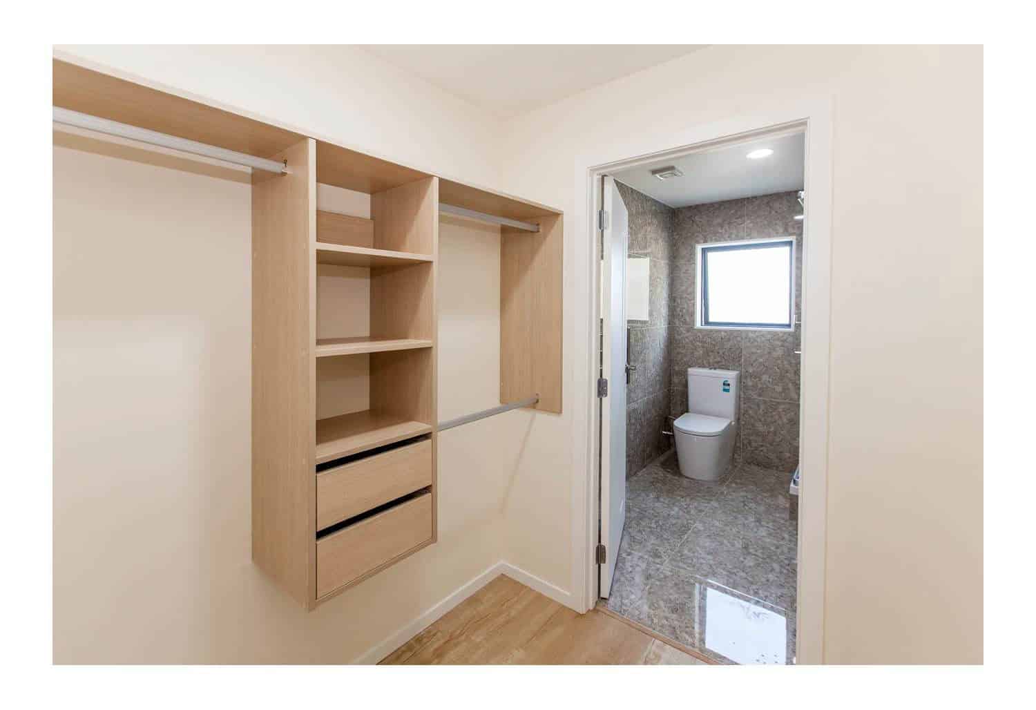 Walk-in wardrobe with open shelving and drawers beside the ensuite, New Windsor