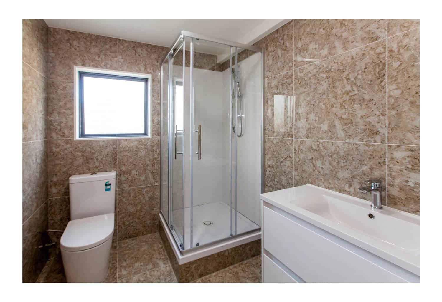Bathroom with a corner shower, toilet, bath and stone-look tiling, New Windsor