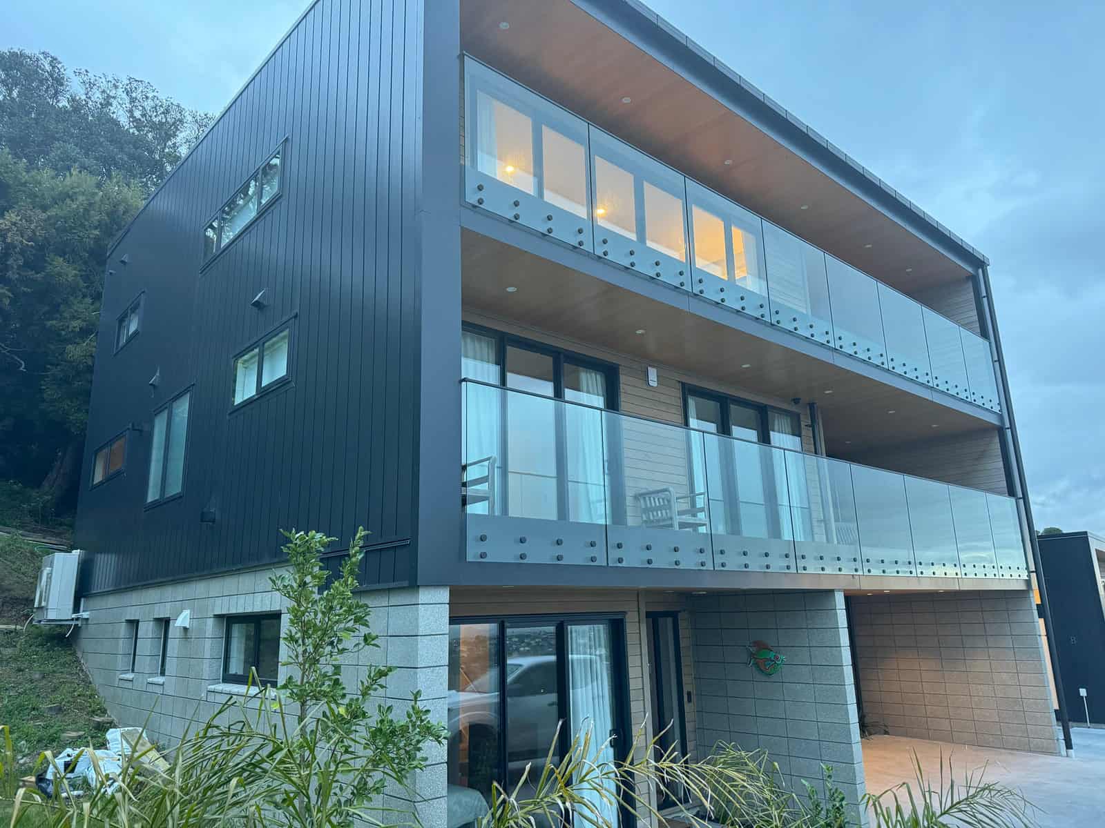 Three-level house with glass balustrades to each balcony, Red Beach