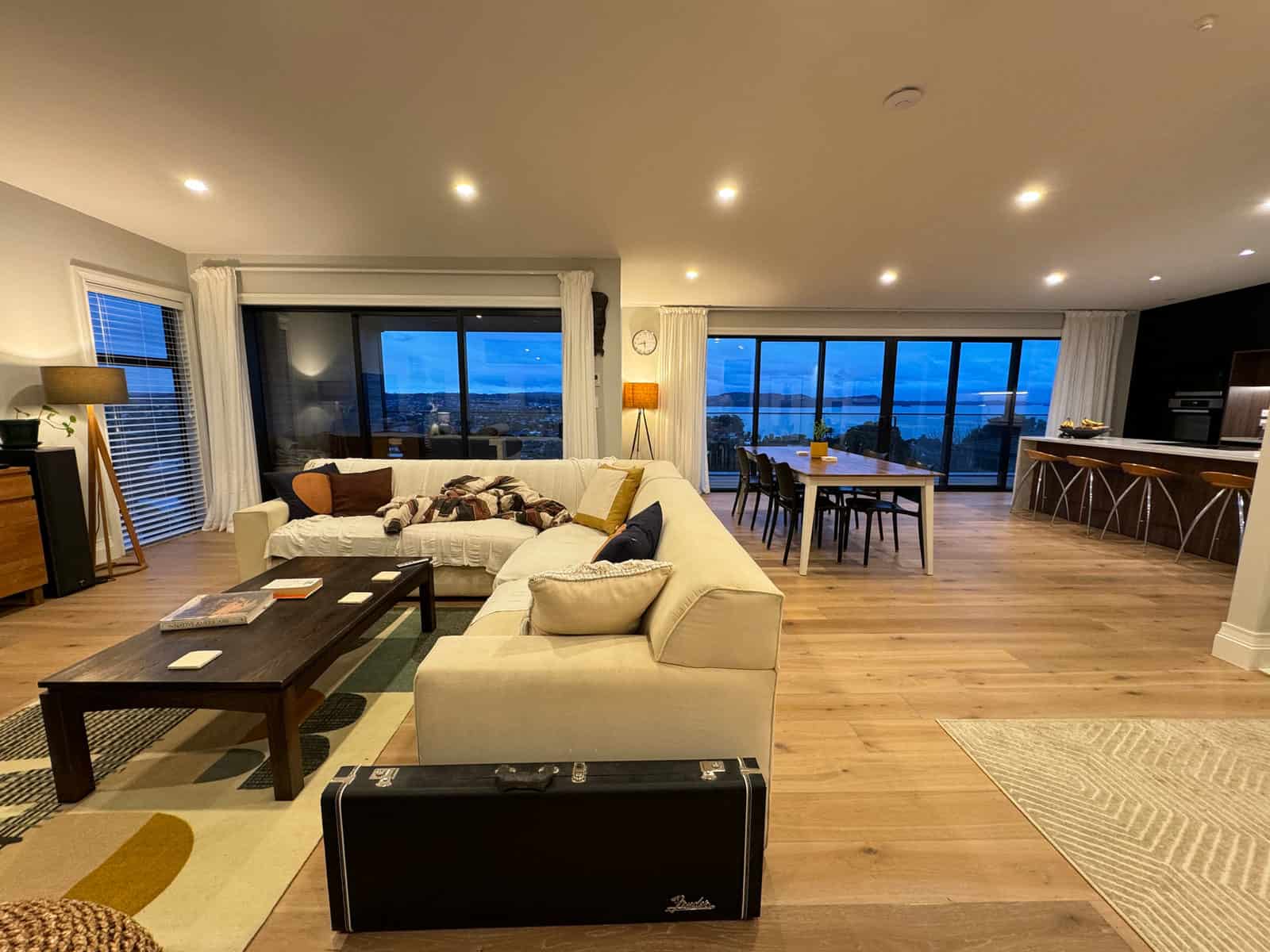 Living room with a modular sofa and full-height glazing to the sea view, Red Beach