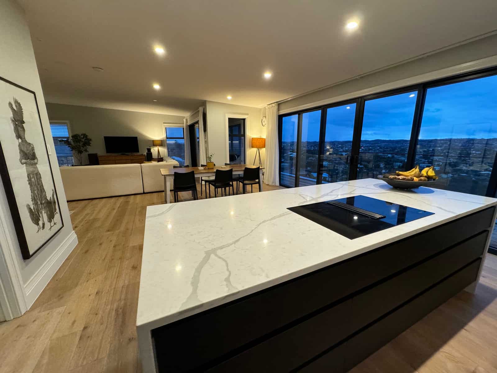 Stone island with an induction hob looking out over the living room to the sea, Red Beach